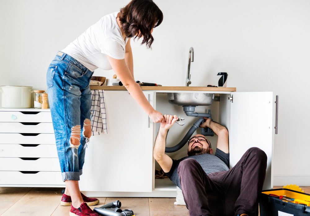 couple-fixing-kitchen-sink